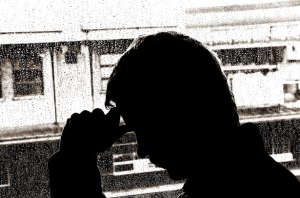 Silhouette of depressed man