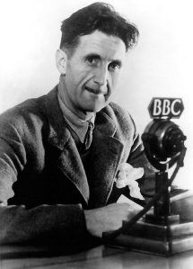George Orwell sitting at a BBC microphone