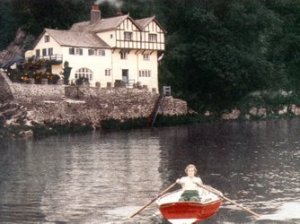 Daphne du Maurier rowing near her old house at Ferryside